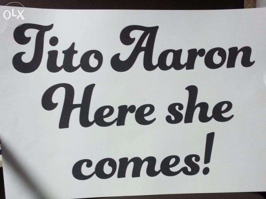 "Tito Aaron Here she comes!" Banner for Bridal March